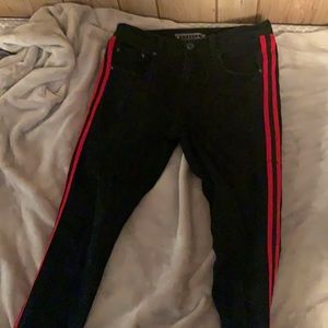 Black decibel jeans with red stripe